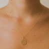 Gold circle and zirconia pendant