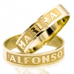 Wide wedding rings in bright and matte gold with exterior engraving